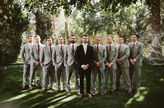 gray groomsmen suits and burgundy ties for burgundy and champagne spring wedding