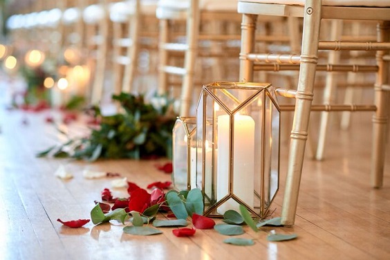 champagne wedding chairs and candles with burgundy shawls for burgundy and champagne winter wedding